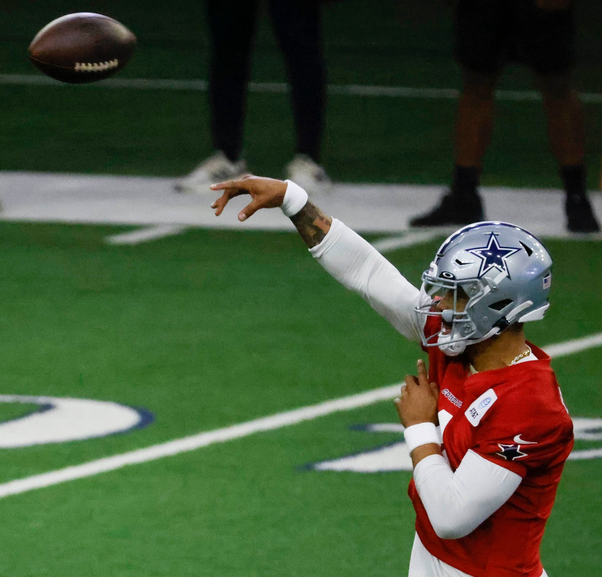 Dallas Cowboys quarterback Dak Prescott (4) throws the ball during a mini camp session at...