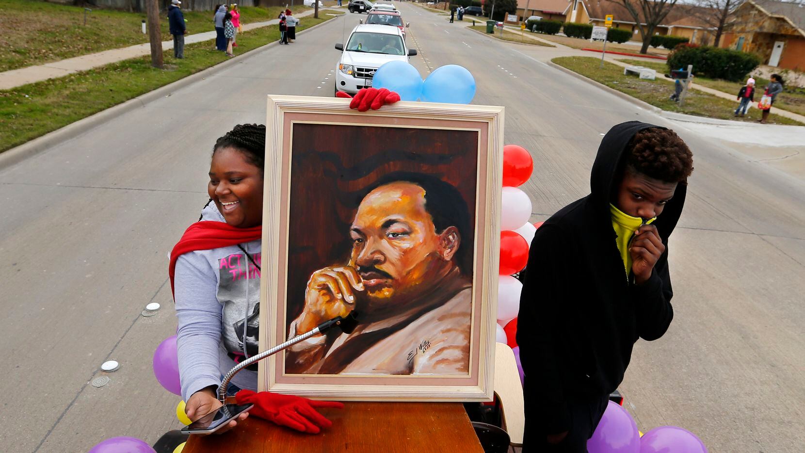 Participants hold a portrait of Martin Luther King, Jr. in the annual MLK Parade and March...