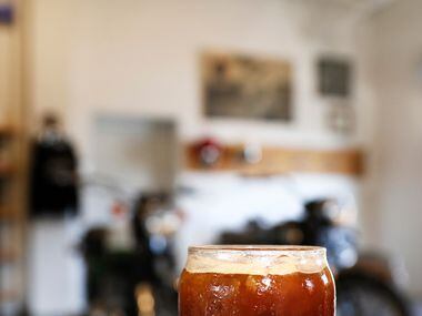 A glass of Sunrise Ice Coffee at Local Moto + Provisions, a vintage motorcycle repair shop...