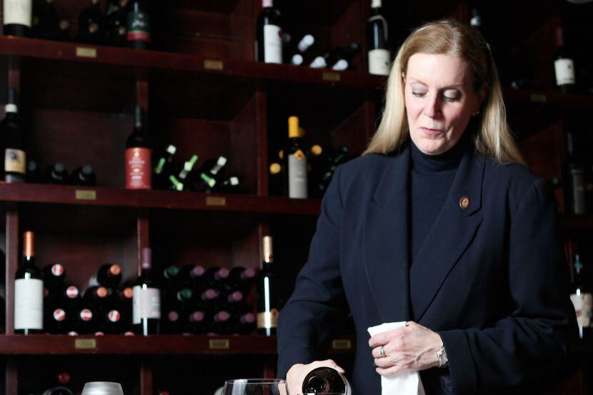 Wine director Barbara Werley pours a glass of wine at Pappas Bros. Steakhouse.