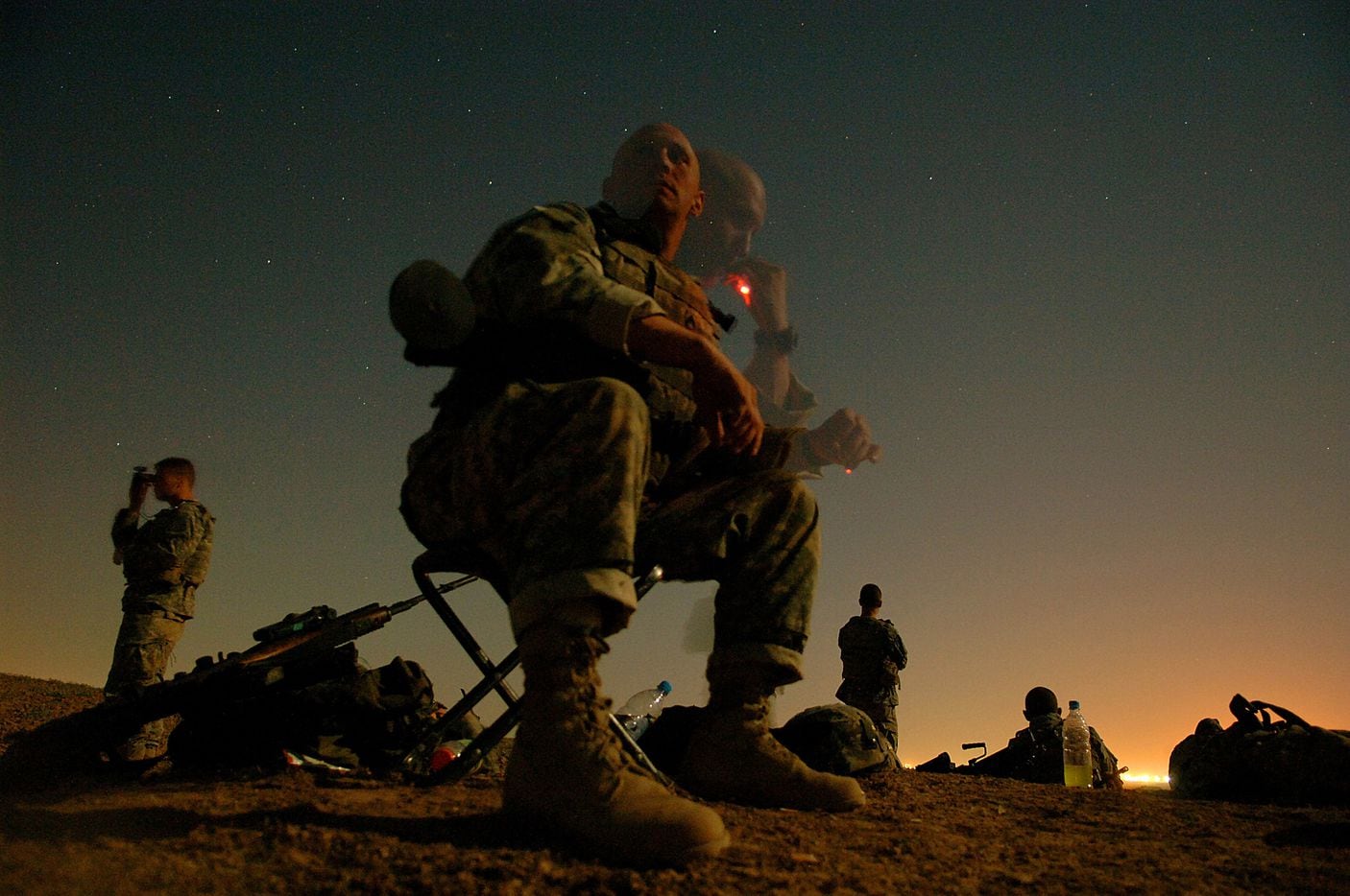 Under the cover of darkness, Platoon Leader SFC Steven Kirk from 4th Platoon Alpha Company,...