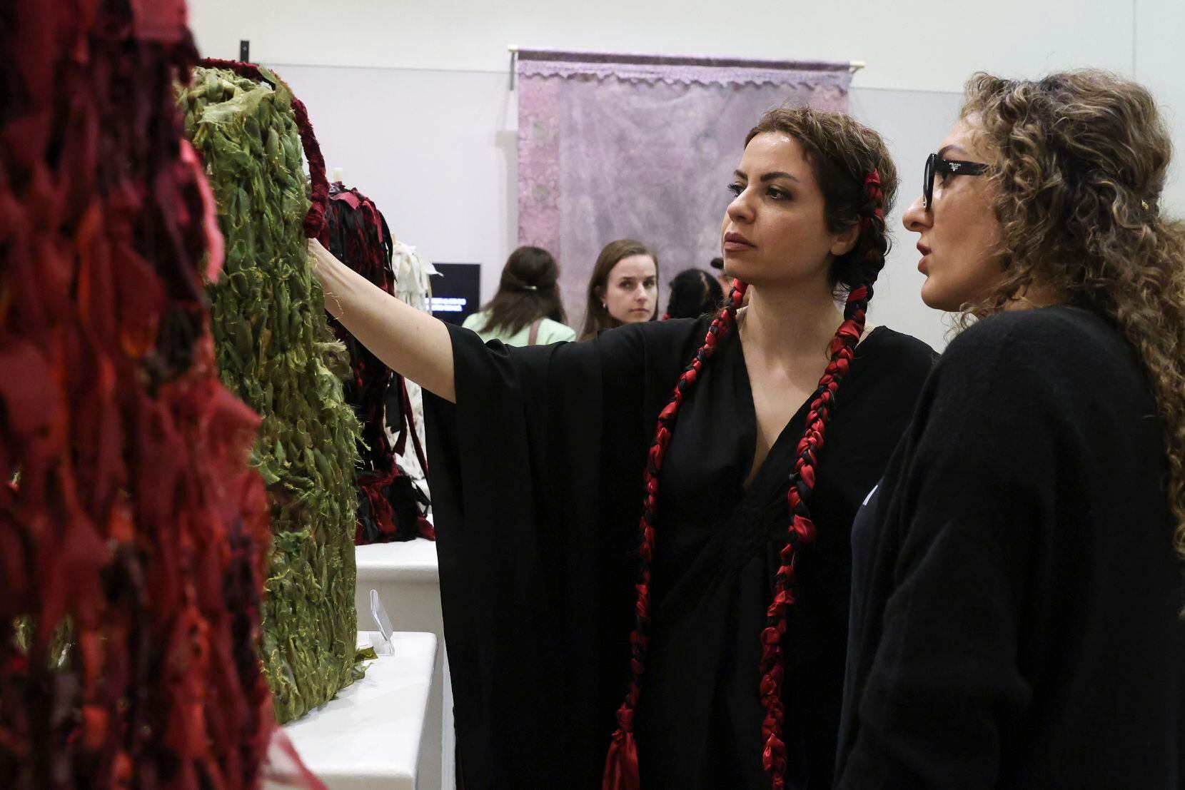 Neda Dehghani and Gita Ferdosian look at “Beyond the Nets” by Maryam Takalou at Irving Arts...