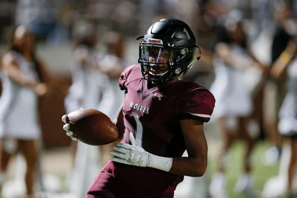 TXHSFB Mansfield Timberview senior running back Stacy Sneed (1) scores a touchdown during...