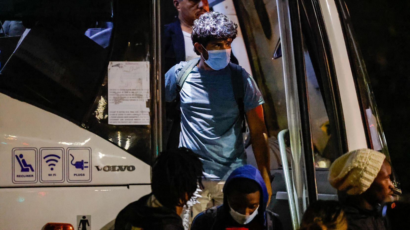 Victor Rodriguez, 26, disembarks the bus that took him along with a group of migrants from...