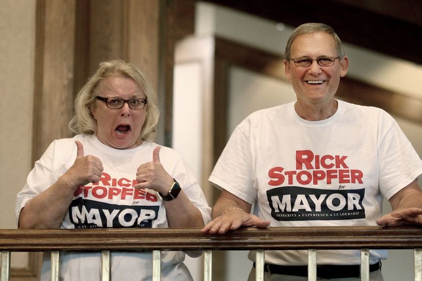 Irving Mayoral candidate Rick Stopfer, with his excited wife Melanie, gives the thumbs up,...