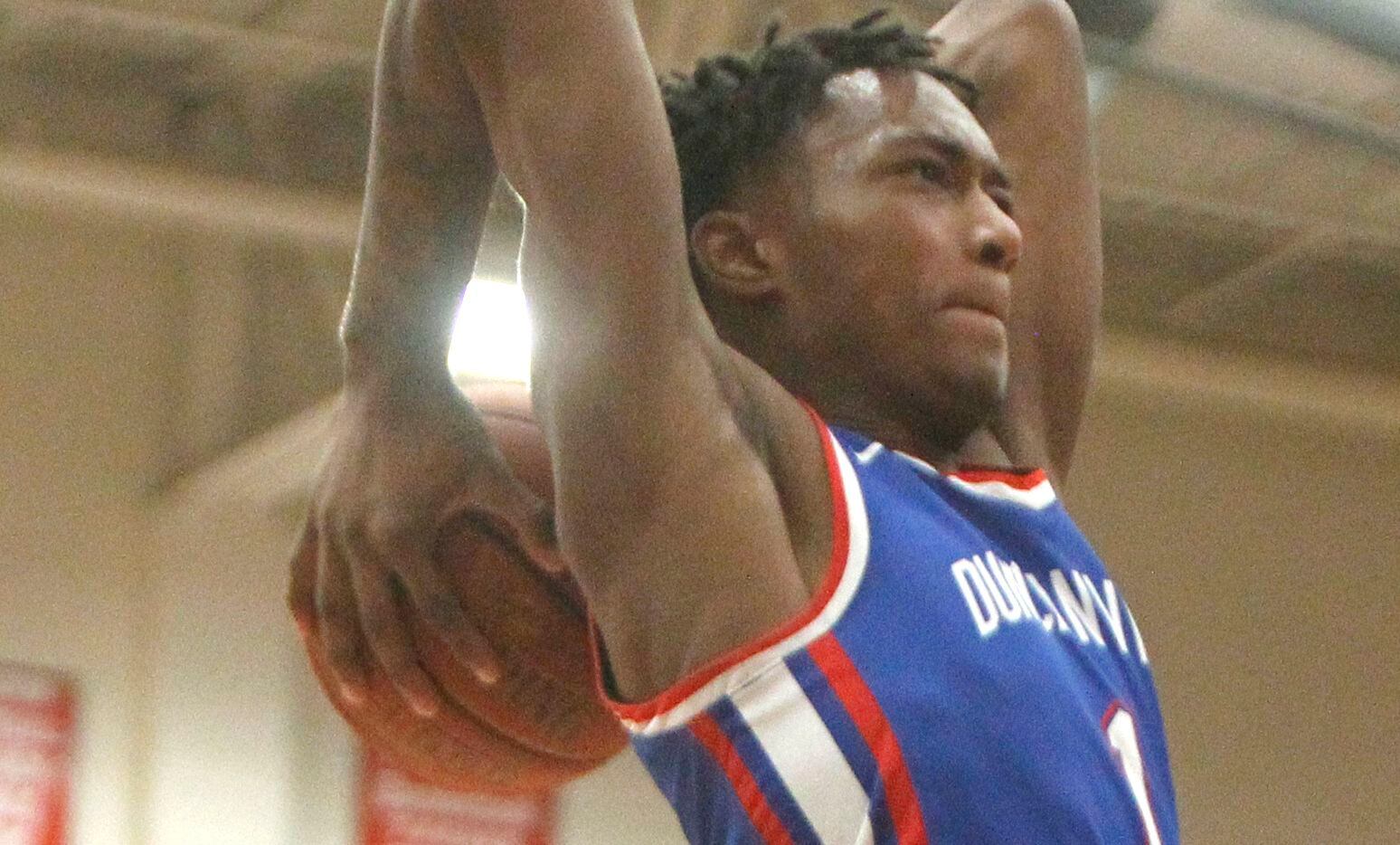 Duncanville forward Ronald Holland (1) skies to the basket to dunk for two of his first half points against Cedar Hill. The two teams played their District 11-6A boys basketball game at Cedar Hill High School in Cedar Hill on January 14, 2022. (Steve Hamm/ Special Contributor)