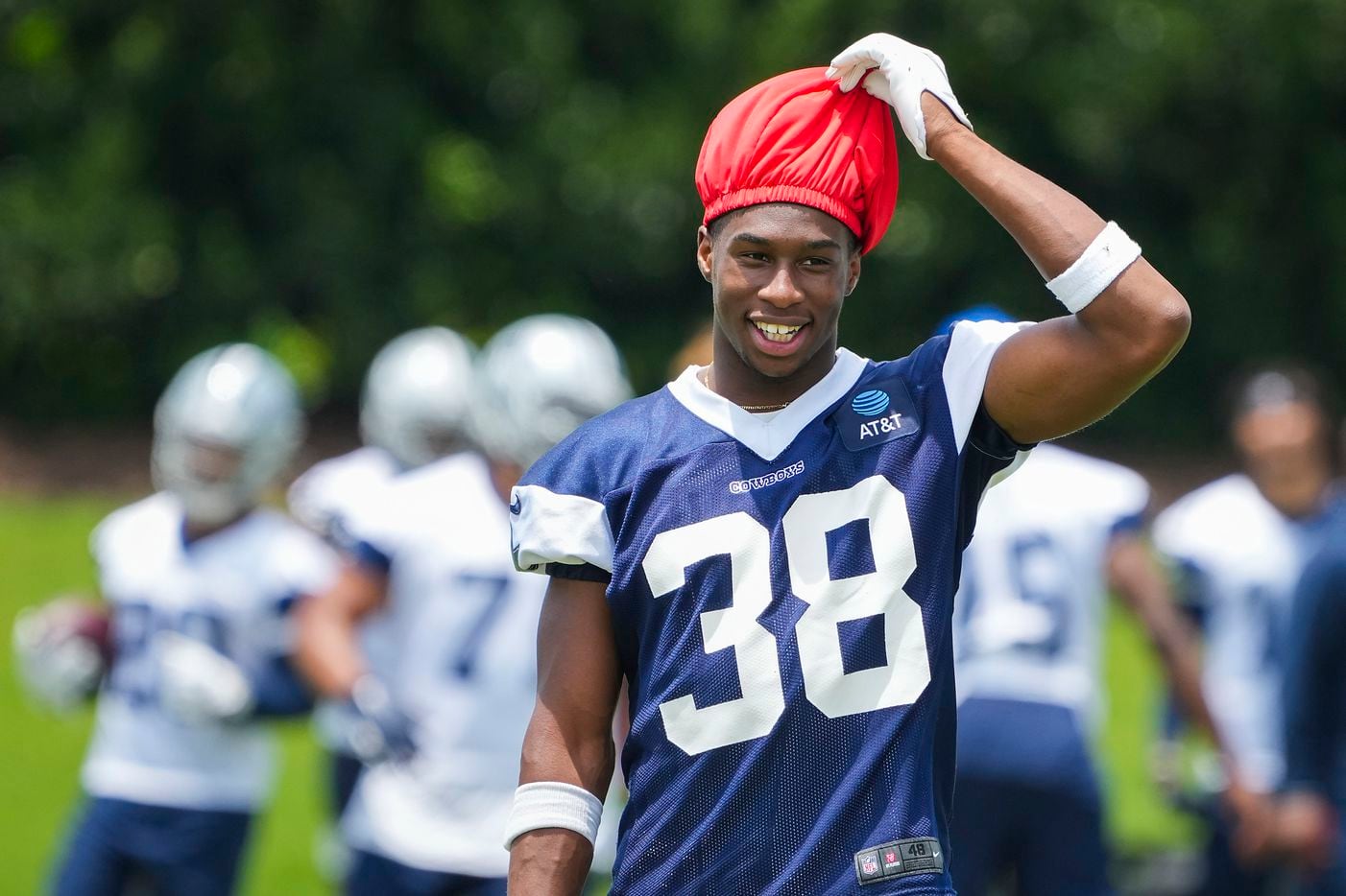 Dallas Cowboys cornerback Israel Mukuamu adjusts a scrimmage cap during a minicamp practice at The Star on Tuesday, June 8, 2021, in Frisco. (Smiley N. Pool/The Dallas Morning News)