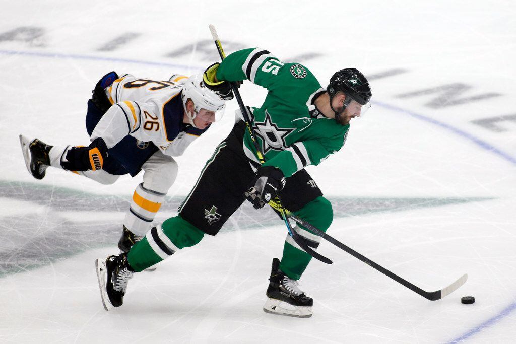 Buffalo Sabres defenseman Rasmus Dahlin, left, is called for the hooking penally as he takes down Dallas Stars left wing Blake Comeau, right, during the second period of an NHL hockey game in Dallas, Thursday, Jan. 16, 2020.