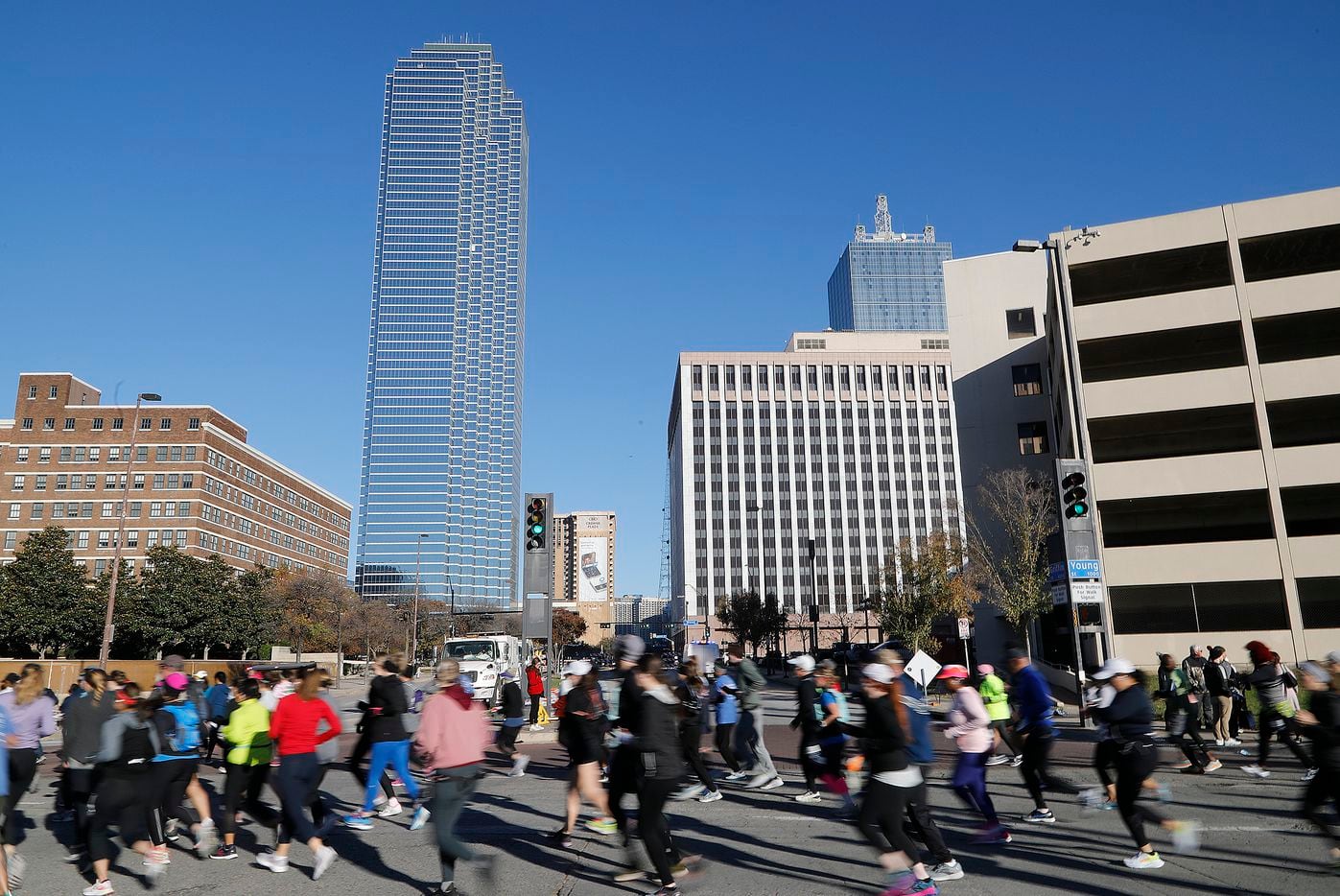 Runners move through downtown as the Dallas Marathon returned on Sunday, December 12, 2021....