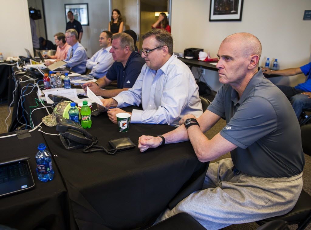 Dallas Mavericks general manager Donnie Nelson (second from right) and head coach Rick Carlisle (right) talk draft picks in their draft room during the Dallas Mavericks 2016 NBA draft party on Thursday, June 23, 2016 at the American Airlines Center in Dallas.  (Ashley Landis/The Dallas Morning News)