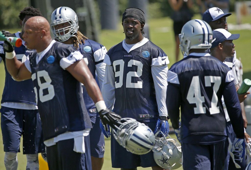 Dallas Cowboys defensive line Cedric Thornton (92) and defensive players take a break on the...