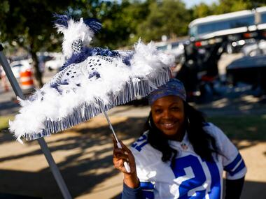 Alethea Peters from DeSoto poses with an umbrella made by a friend for her wedding as she...