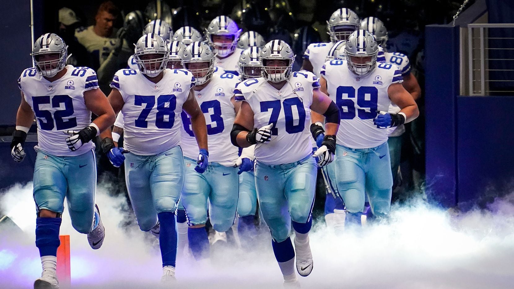 Dallas Cowboys offensive guard Zack Martin (70) leads the team onto the field to face the New York Giants in an NFL football game at AT&T Stadium on Sunday, Oct. 11, 2020, in Arlington. (Smiley N. Pool/The Dallas Morning News)