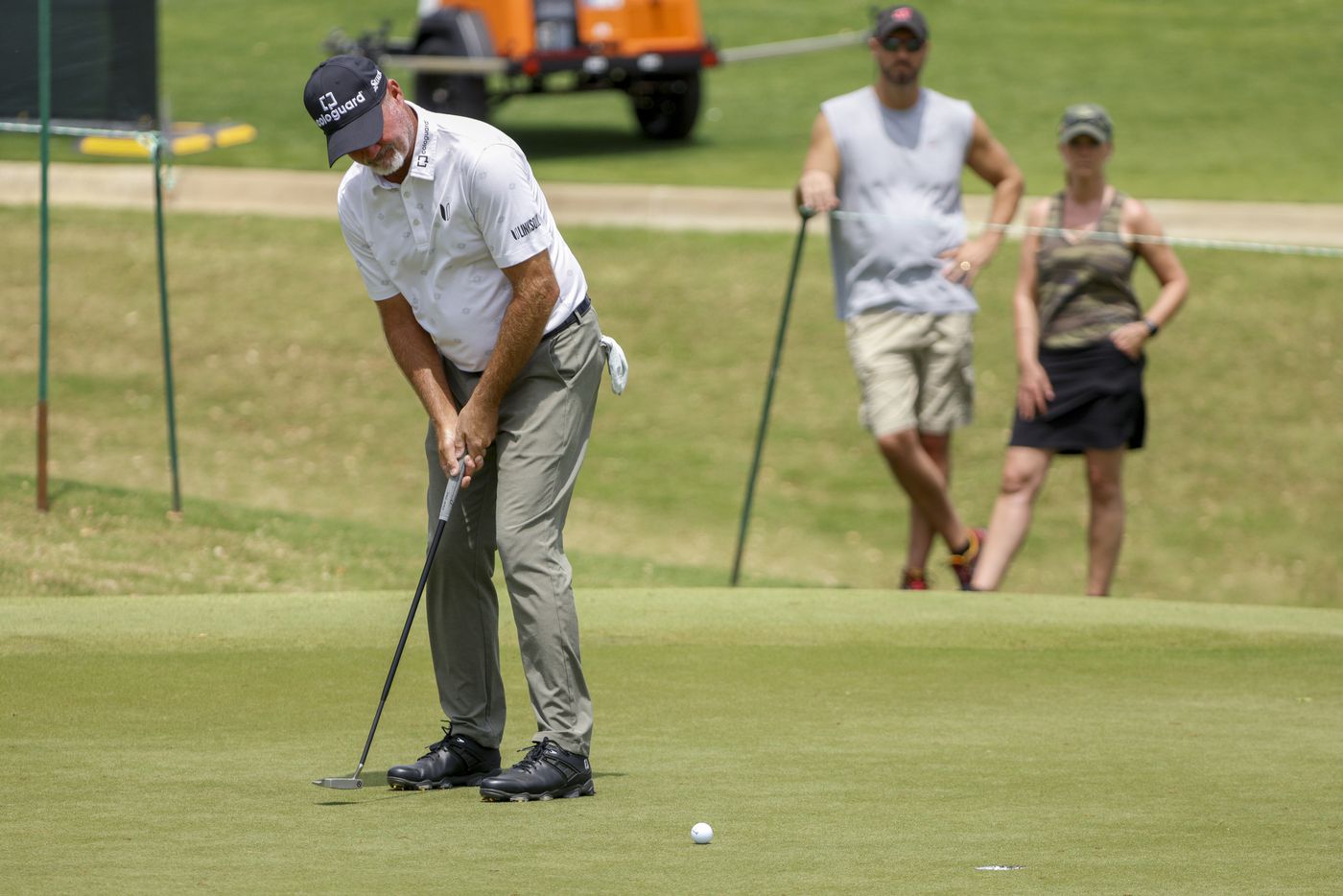 Professional golfer Jerry Kelly makes a putt for birdie on the ninth hole during the first...