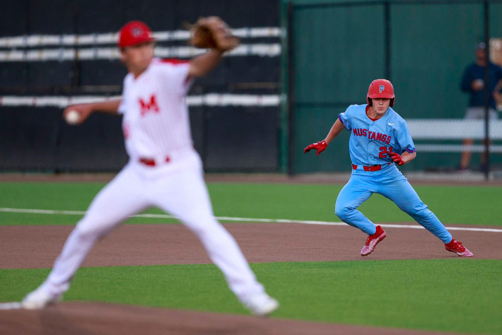 Richardson Pearce's Trent Williams (21) jumps towards second base as Flower Mound Marcus...