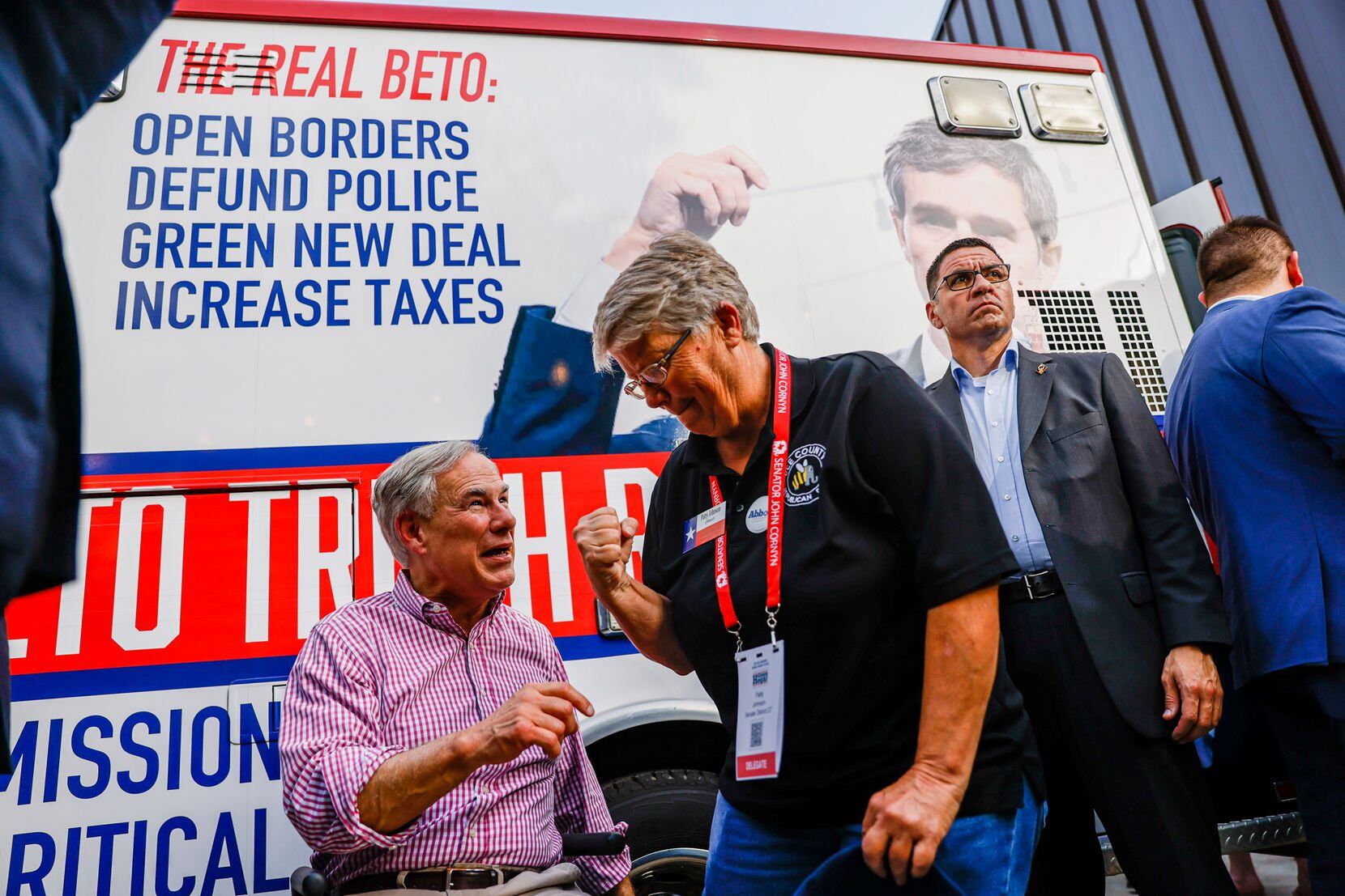 Texas Governor Greg Abbott talks with Delegate Patty Johnson from Senate District 27 next to...