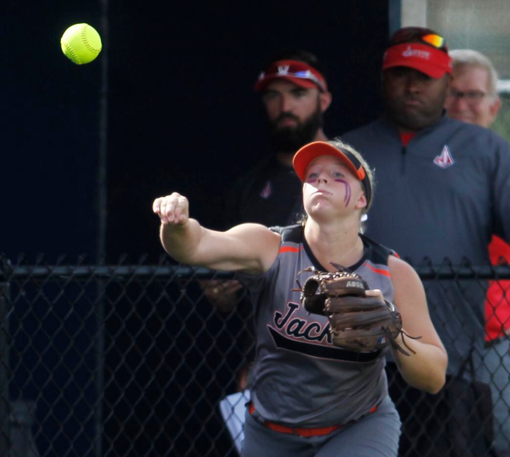 Rockwall infielder Ashley Minor (4) fires the ball back in after making a long run to catch...