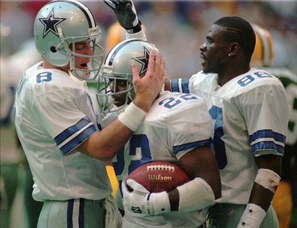 Dallas Cowboys Troy Aikman (8), Emmitt Smith (22) and Michael Irvin (88) celebrate Smith's...