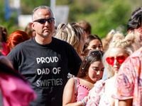 Francisco Martinez stands in line with his two daughters before the Taylor Swift "Eras Tour"...
