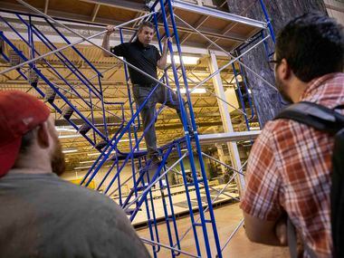 Director Tomer Zvulun (center) talks with his crew on the scaffolding that will be used for...