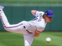 Texas Rangers pitcher Spencer Howard delivers during the second inning of a spring training...