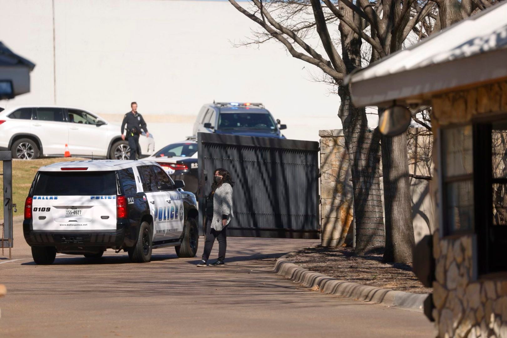 Dallas police officers work the scene at the Dallas Zoo on Friday morning after a clouded...