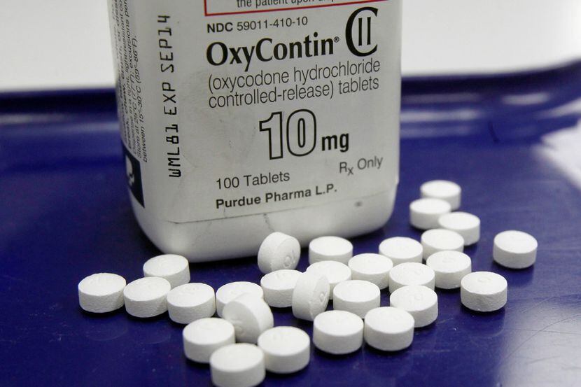 This Feb. 19, 2013, photo, shows OxyContin pills arranged for a photo at a pharmacy in...